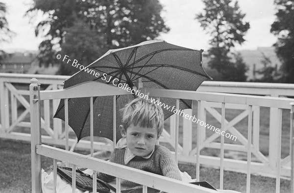 LOURDES HOSPITAL CHILD WITH PARASOL  PADDY GARVEY  20 ST MARYS TERRACE